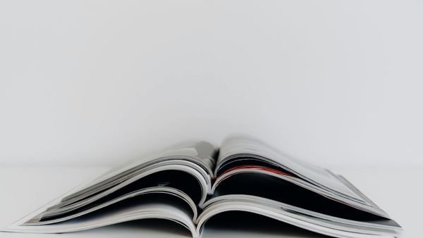 An open bound booklet showing printed pages.