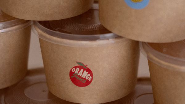 Kraft containers with printed adhesive labels applied.