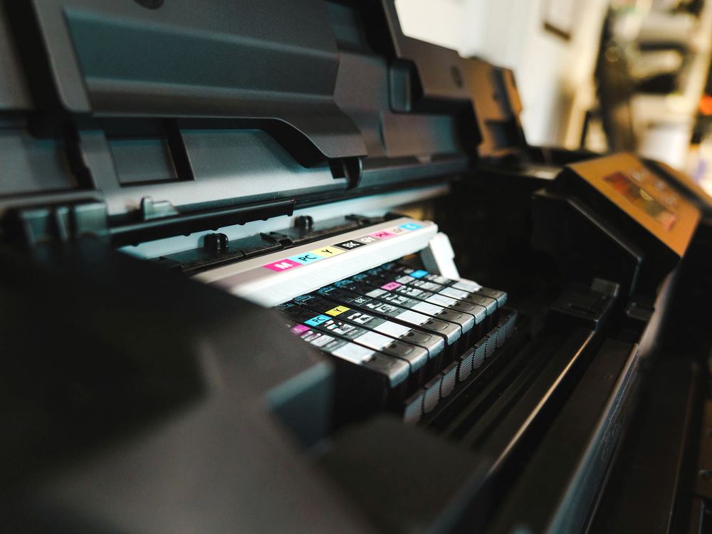 The print head and colour ink cartridges of a modern production printer.